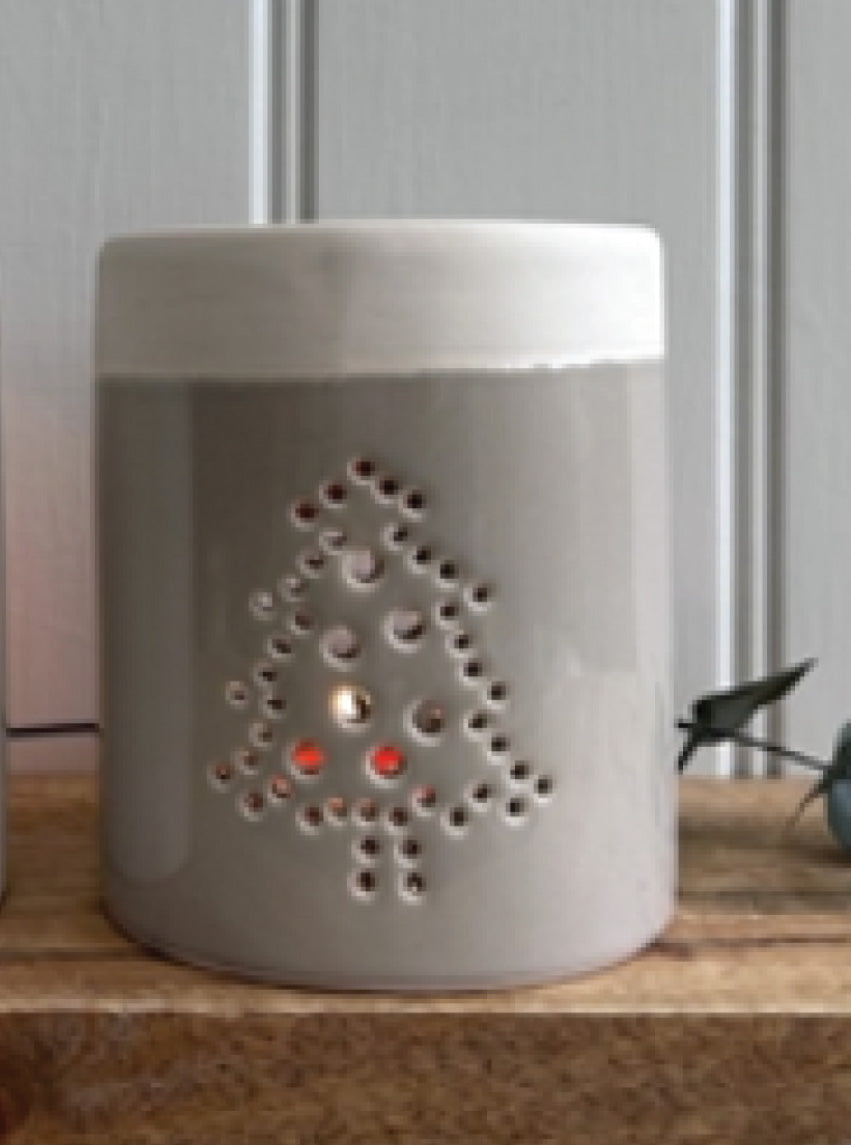 Christmas Ceramic Burner for Oil & Wax Melts with a Cut-away Tree Design.